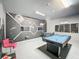 Entertainment space with a pool table, foosball, and custom Star Wars-themed wall art at 394 Orange Cosmos Blvd, Davenport, FL 33837