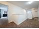Hallway offers access to various rooms with neutral wall paint and carpet floors at 394 Orange Cosmos Blvd, Davenport, FL 33837