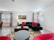 Cozy living room featuring modern furniture, stylish decor, and bright windows at 394 Orange Cosmos Blvd, Davenport, FL 33837
