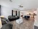 Open-concept living space seamlessly connects the living room to the dining area and kitchen at 394 Orange Cosmos Blvd, Davenport, FL 33837