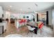 Spacious open-concept area with a kitchen, bar seating, dining table and living room at 394 Orange Cosmos Blvd, Davenport, FL 33837