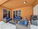 Enjoy this relaxing outdoor patio space with sliding glass door access to the interior at 394 Orange Cosmos Blvd, Davenport, FL 33837
