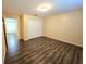 This bedroom features modern flooring and a spacious closet at 5451 Vineland Rd # 111, Orlando, FL 32811