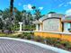 Elegant community entrance sign surrounded by lush landscaping and mature palm trees, creating a welcoming atmosphere at 5451 Vineland Rd # 111, Orlando, FL 32811