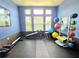 Dedicated exercise room with yoga mats, balance balls, and weightlifting equipment at 5451 Vineland Rd # 111, Orlando, FL 32811
