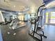 Bright gym featuring treadmills, a pull-up bar, and ample space for exercise at 5451 Vineland Rd # 111, Orlando, FL 32811