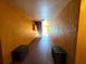 A cozy hallway leading to the stairs at 5451 Vineland Rd # 111, Orlando, FL 32811