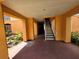 Well-maintained hallway with staircase access, providing a clean and convenient passage to upper levels at 5451 Vineland Rd # 111, Orlando, FL 32811