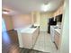Bright kitchen featuring a breakfast bar and sleek appliances at 5451 Vineland Rd # 111, Orlando, FL 32811