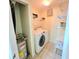 Laundry room with modern washer and dryer at 5451 Vineland Rd # 111, Orlando, FL 32811