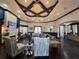 Spacious clubhouse living area with a cozy fireplace and comfortable seating arrangements at 5451 Vineland Rd # 111, Orlando, FL 32811