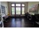 Office space with dark hardwood floors and lots of natural light at 5451 Vineland Rd # 111, Orlando, FL 32811