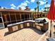 Outdoor kitchen with stainless steel appliances, perfect for grilling and outdoor dining at 5451 Vineland Rd # 111, Orlando, FL 32811