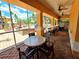 Charming patio with comfortable seating and views of the community pool at 5451 Vineland Rd # 111, Orlando, FL 32811