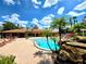 Beautiful pool with rock features and a spacious deck for relaxing and entertaining at 5451 Vineland Rd # 111, Orlando, FL 32811