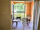Relax on the porch with outdoor seating and a view of the lush landscaping at 5451 Vineland Rd # 111, Orlando, FL 32811