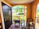 Porch featuring outdoor seating and lush green views at 5451 Vineland Rd # 111, Orlando, FL 32811