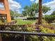 Enjoy community green space views from the covered porch at 5451 Vineland Rd # 111, Orlando, FL 32811