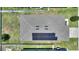 Aerial view of a home with solar panels, fenced yard, and well-maintained roof in a residential neighborhood at 5816 Beefmaster Rd, St Cloud, FL 34771