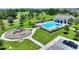 Aerial view of community amenities including a playground, pool, clubhouse and green space at 5816 Beefmaster Rd, St Cloud, FL 34771