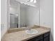Bathroom with a large mirror and a single sink at 5816 Beefmaster Rd, St Cloud, FL 34771