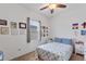 Bright bedroom with a ceiling fan and a window for natural light at 5816 Beefmaster Rd, St Cloud, FL 34771