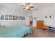 Bedroom featuring a dresser, end tables and a door leading to another room at 5816 Beefmaster Rd, St Cloud, FL 34771