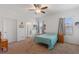 Bedroom featuring a view of the bathroom and a window for natural light at 5816 Beefmaster Rd, St Cloud, FL 34771