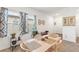 Dining area features matching table and chairs and two windows at 5816 Beefmaster Rd, St Cloud, FL 34771