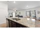 Spacious kitchen island with double sink, granite countertop, and stylish faucet at 5816 Beefmaster Rd, St Cloud, FL 34771