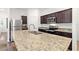 Open-concept kitchen featuring a large island, stainless steel appliances, and granite countertops at 5816 Beefmaster Rd, St Cloud, FL 34771