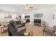 Open-concept living room with ample seating, a ceiling fan, and bright lighting at 5816 Beefmaster Rd, St Cloud, FL 34771