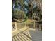 Wooden deck overlooking a lush and sprawling backyard at 585 Mourning Dove Cir, Lake Mary, FL 32746