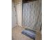 Bathroom featuring neutral tiled flooring, shower with decorative curtain and white doors at 585 Mourning Dove Cir, Lake Mary, FL 32746