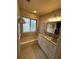 Bathroom featuring tiled floor, white vanity with granite, and bath tub at 585 Mourning Dove Cir, Lake Mary, FL 32746