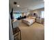 Large bedroom featuring a desk and a plush bed with bedside tables at 585 Mourning Dove Cir, Lake Mary, FL 32746