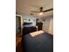 Comfortable bedroom featuring a ceiling fan, large dresser, and ample natural light at 585 Mourning Dove Cir, Lake Mary, FL 32746