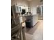 Well-appointed kitchen featuring an island cooktop and stainless steel appliances at 585 Mourning Dove Cir, Lake Mary, FL 32746