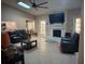 Spacious living room with vaulted ceilings, brick fireplace, and access to the kitchen at 585 Mourning Dove Cir, Lake Mary, FL 32746