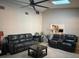 Cozy living room featuring comfortable leather seating and an open view into the kitchen at 585 Mourning Dove Cir, Lake Mary, FL 32746