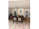 Covered patio has ample seating with a tiled floor at 585 Mourning Dove Cir, Lake Mary, FL 32746