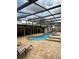 Large backyard pool and hot tub with full screen enclosure at 585 Mourning Dove Cir, Lake Mary, FL 32746