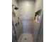 Close up of updated shower with neutral tile and built in shampoo storage at 585 Mourning Dove Cir, Lake Mary, FL 32746