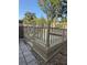 Multi-tiered wooden deck, surrounded by stone pavers and gravel, offers an outdoor living space at 585 Mourning Dove Cir, Lake Mary, FL 32746