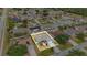 Aerial view of a home outlined in white, nestled in a neighborhood with mature trees and well-kept lawns at 604 Kangaroo Dr, Poinciana, FL 34759