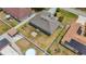 Aerial view of a home with a large fenced backyard, detached shed, and proximity to neighboring houses at 604 Kangaroo Dr, Poinciana, FL 34759