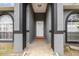 Inviting front entrance with a decorative door and neutral color scheme at 604 Kangaroo Dr, Poinciana, FL 34759