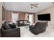 Cozy living room with tile flooring and sliding door access to the backyard at 604 Kangaroo Dr, Poinciana, FL 34759