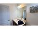 Bathroom featuring a large mirror, a vanity with a sink, and fresh towels at 6041 Broad Oak Dr, Davenport, FL 33837
