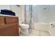 Cozy bathroom with a shower/tub combination, toilet, and vanity with fresh towels at 6041 Broad Oak Dr, Davenport, FL 33837